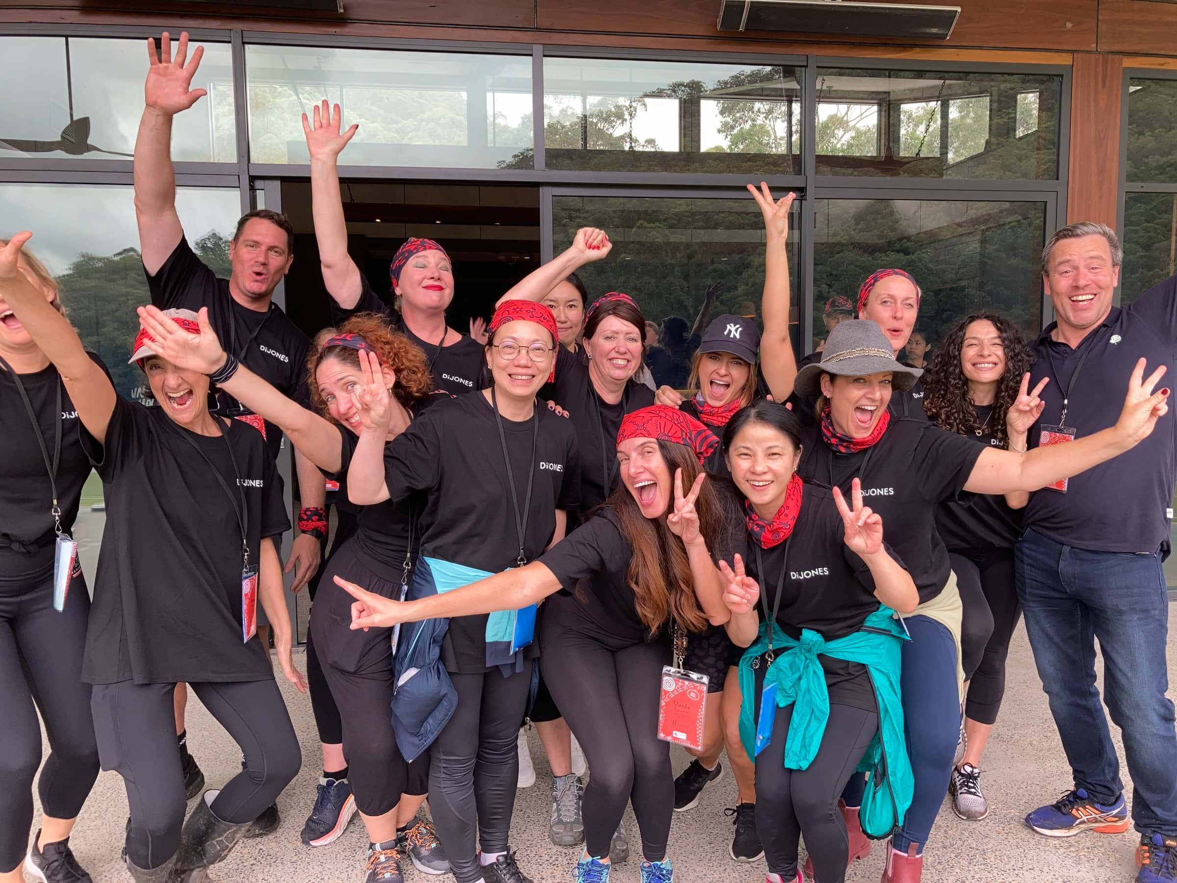 A corporate team laughing and celebrating together at a PowerProv workshop
